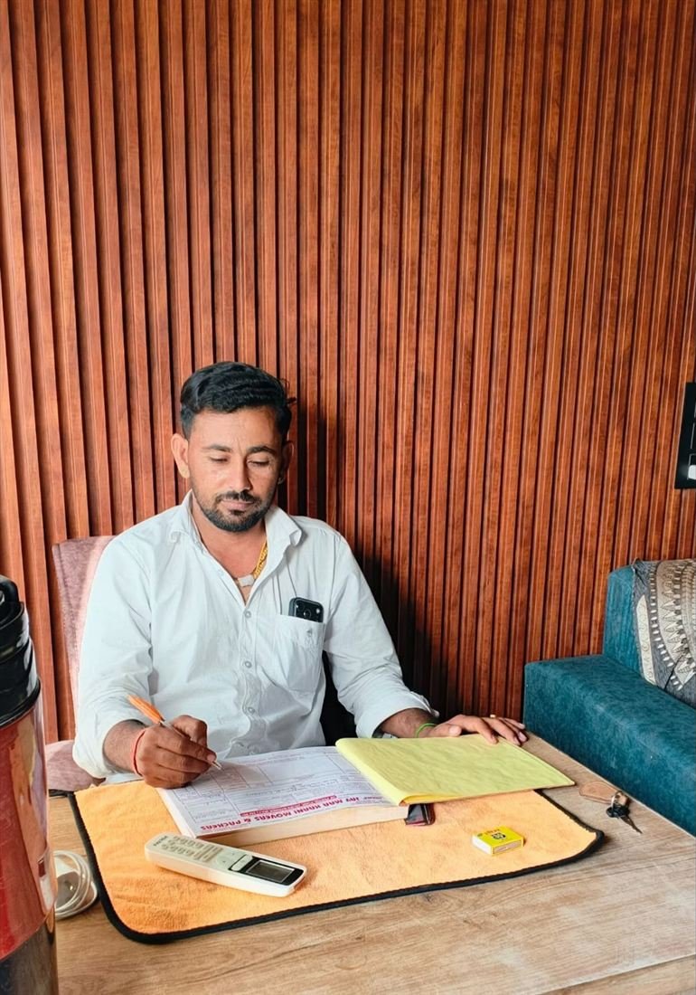 Booking being recorded in the Jay Maa Karni Movers and Packers register at the Barmer office